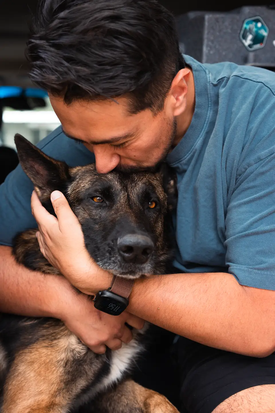 Henry of GTX K9 Dog Training embracing a dog